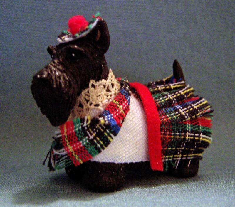 dollhouse black scottish terrier in tartan outfit