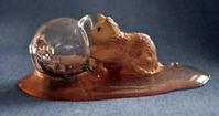 dollhouse cat with spilled fishbowl