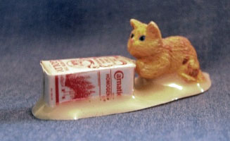 dollhouse cat with spilled milk container