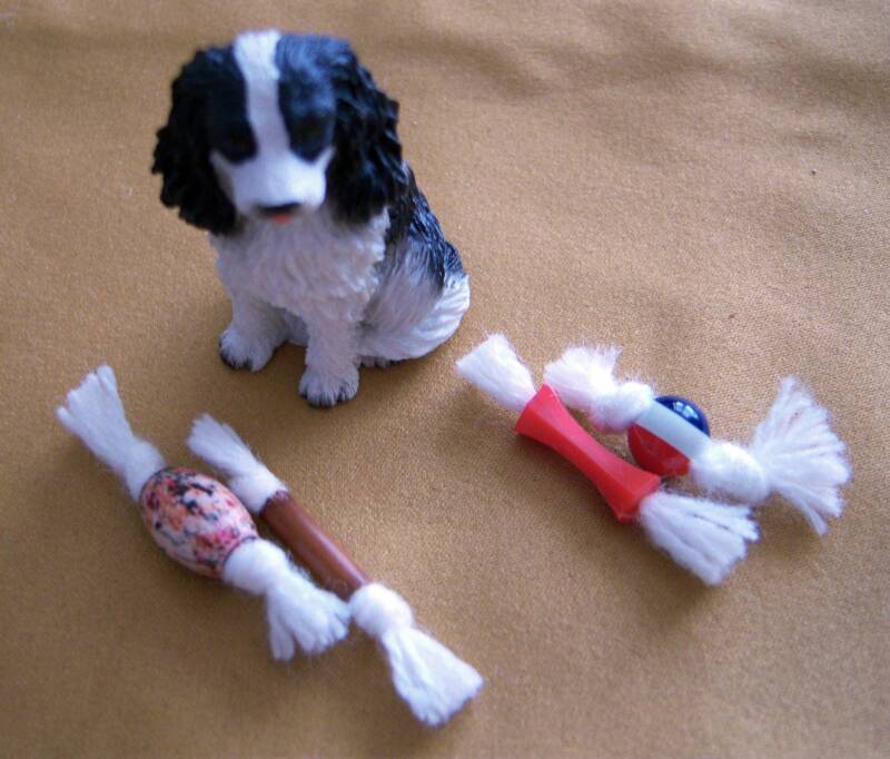 dollhouse spaniel with dog tug toys