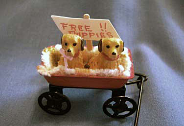 dollhouse puppies in red wagon