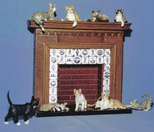 dollhouse cats with miniature fireplace